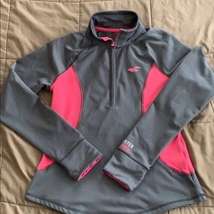 Zipper workout pullover with thumb holes.